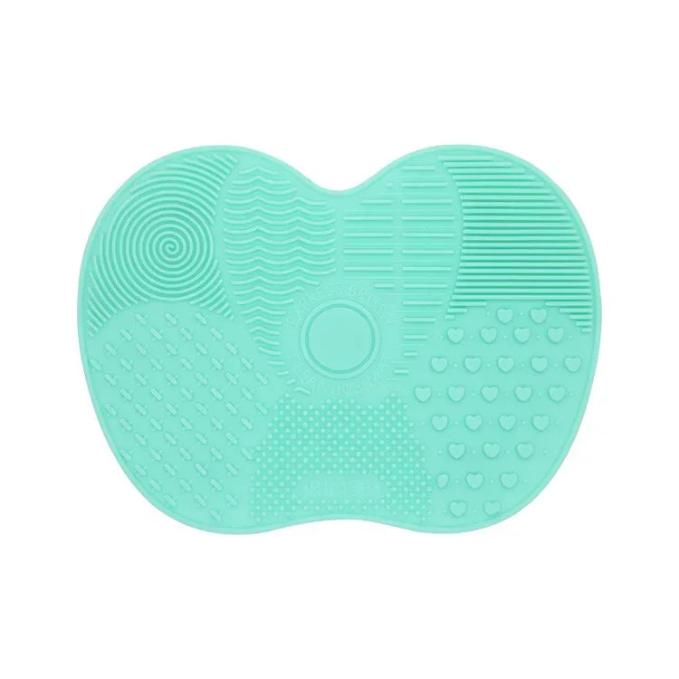 Nova Glam Essentials colorful silicone brush cleaner pad removing foundation from makeup brushes