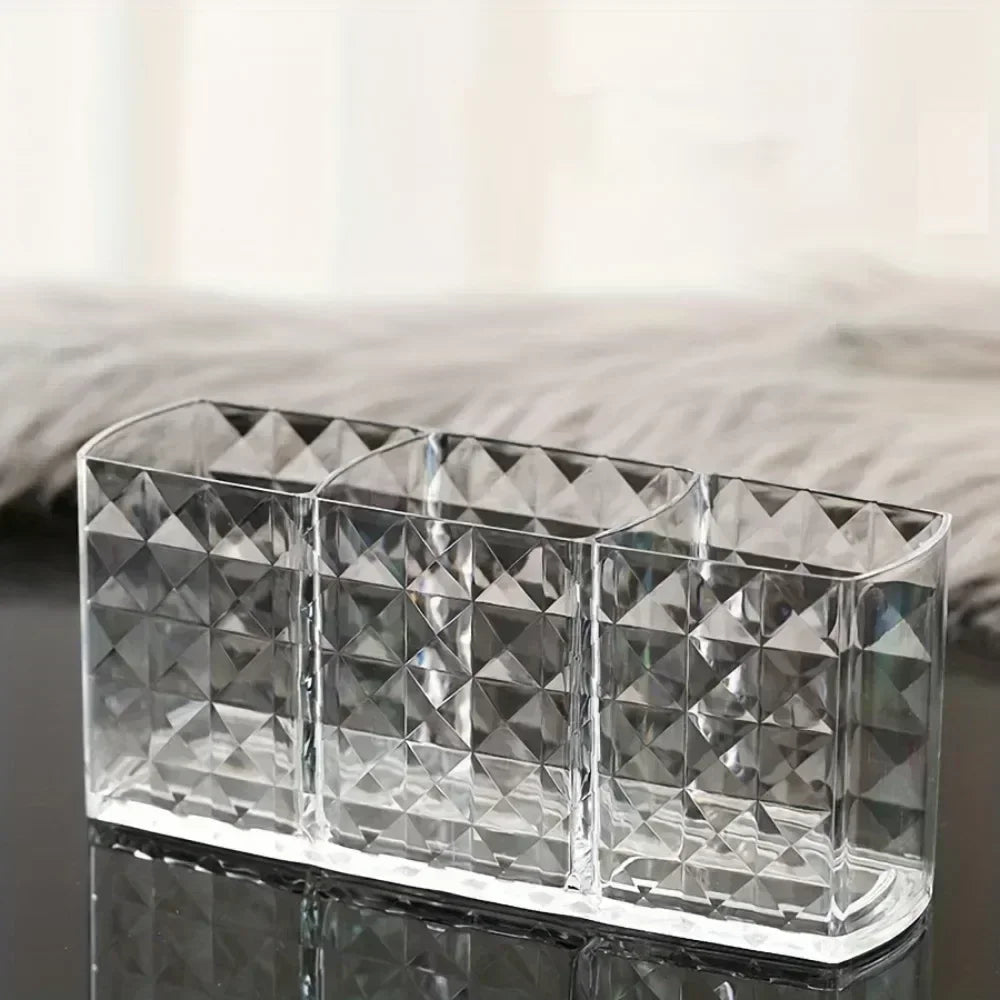 Nova Glam Essentials diamond-shaped acrylic makeup brush holder on a modern desk