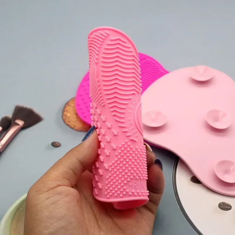Nova Glam Essentials colorful silicone brush cleaner pad removing foundation from makeup brushes