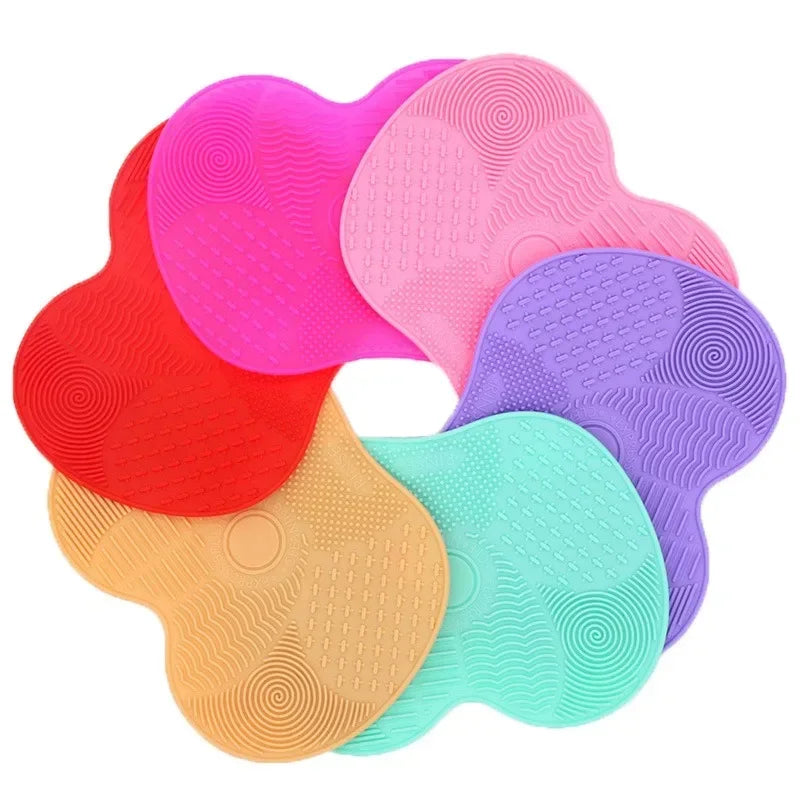 Nova Glam Essentials colorful silicone brush cleaner pad removing foundation from makeup brushes