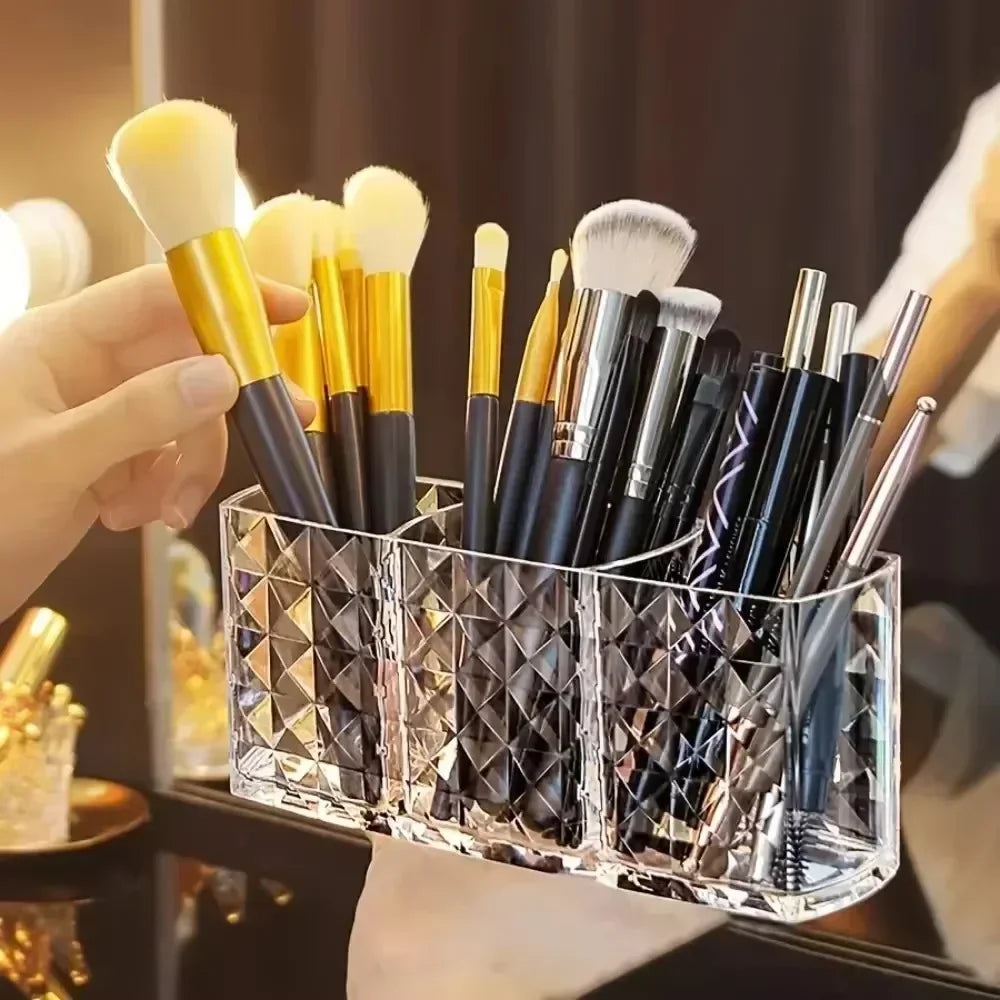 Nova Glam Essentials diamond-shaped acrylic makeup brush holder on a modern desk