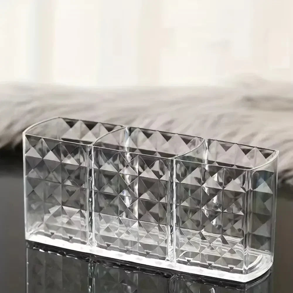 Nova Glam Essentials diamond-shaped acrylic makeup brush holder on a modern desk