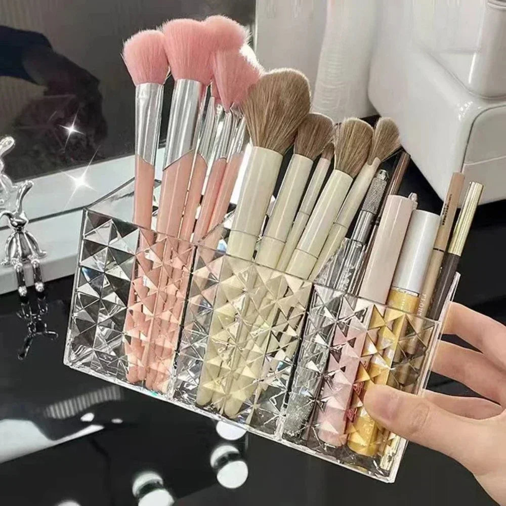 Nova Glam Essentials diamond-shaped acrylic makeup brush holder on a modern desk